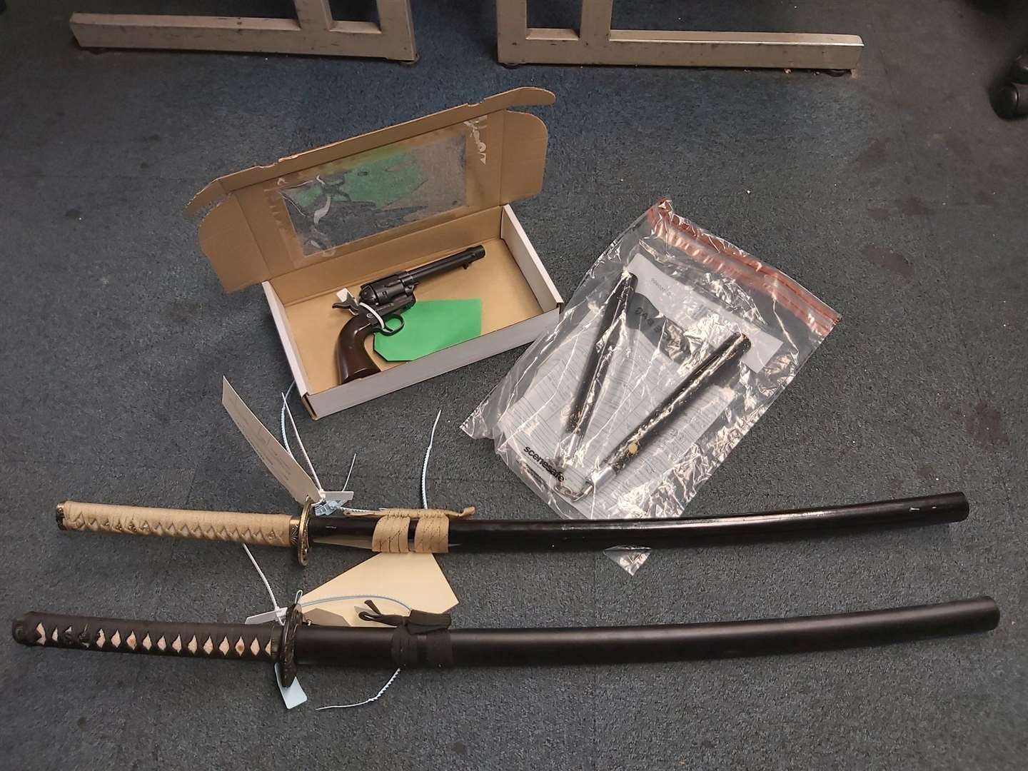 Two samurai swords, an imitation gun and nunchucks were seized by police. Picture: Kent Police