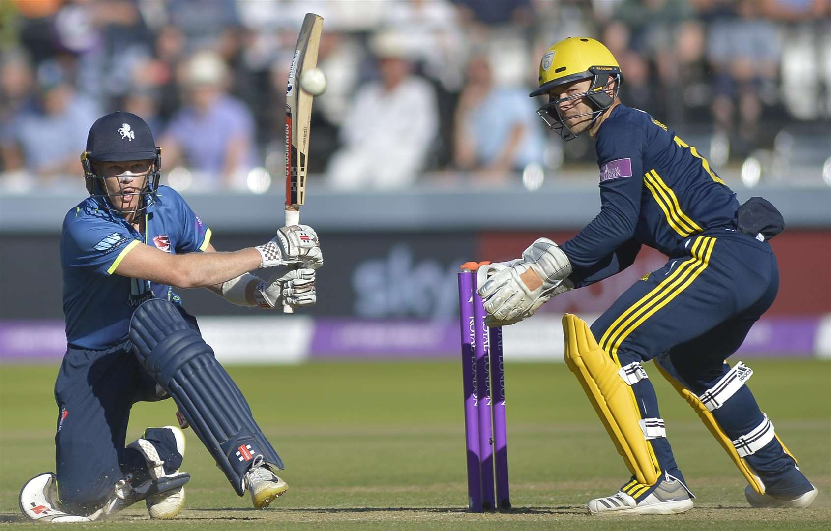 Sam Billings sweeps behind square Picture: Ady Kerry