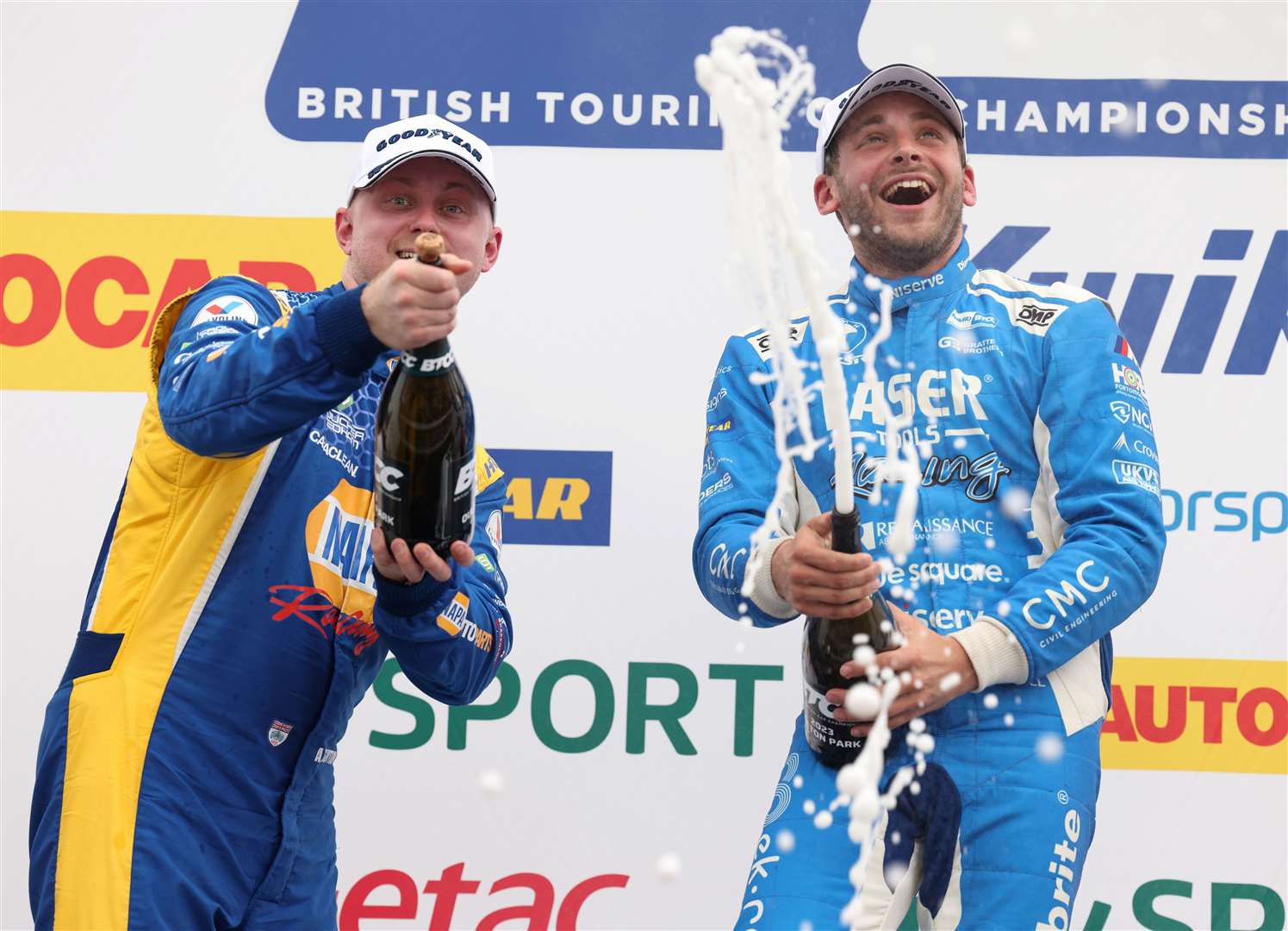 Jake Hill and Ash Sutton spray the champagne on the podium at Oulton Park. Picture: BTCC/Jakob Ebrey