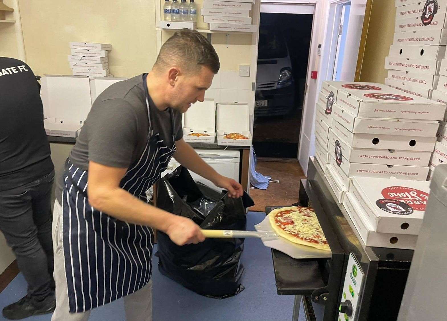 Preparing the mammoth pizza order at Ramsgate Football Club