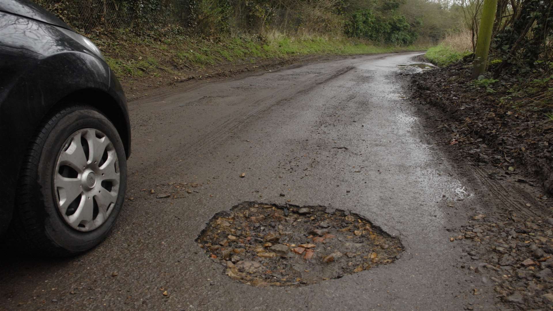 KCC have been criticised for letting Canterbury's roads slip into a "medieval" state of disrepair.