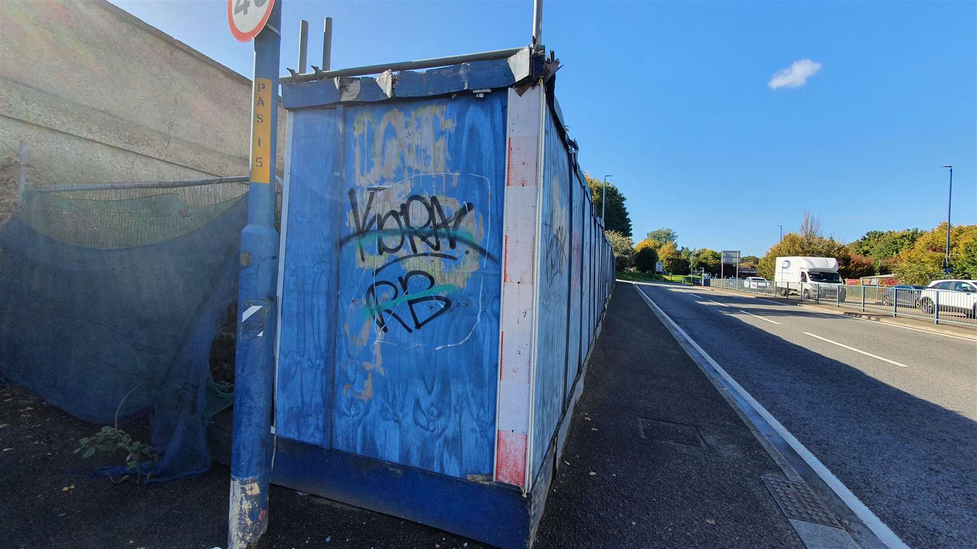 The blue hoardings in Pier Road, Gillingham have been damaged by weathering and graffiti