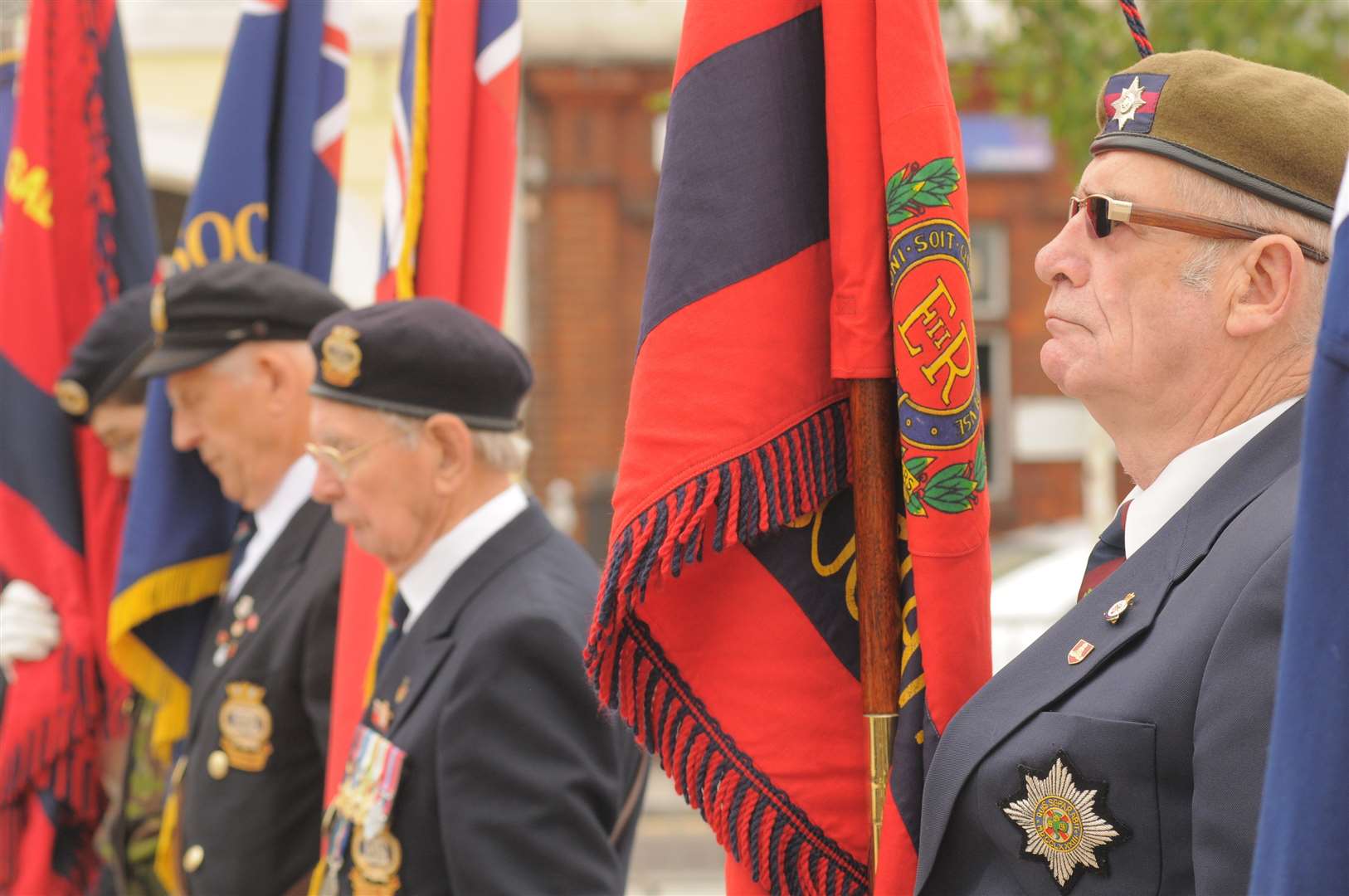 Standard bears stand in formation at a Armed Forces Day ceremony in Community Square, Gravesend