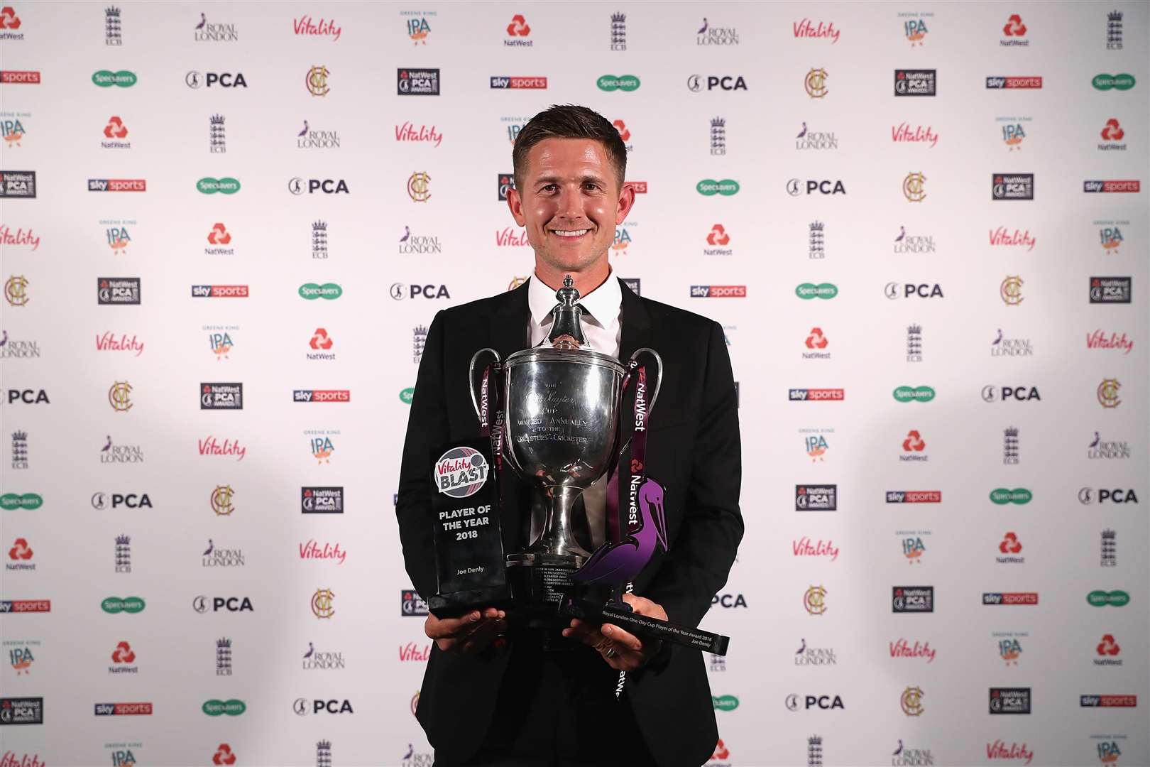 Kent's Joe Denly with the Vitality Blast and Royal London One-Day Player-of-the-Year trophies during the NatWest PCA Awards