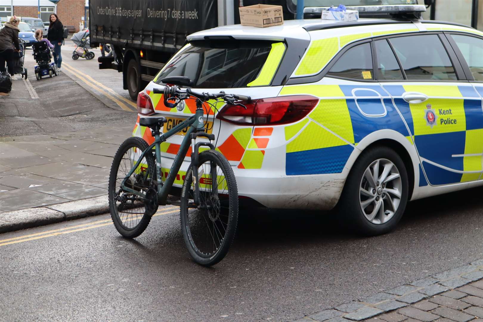 Bradley's bike propped up at the back of a police car in Sheerness High Street (24602747)