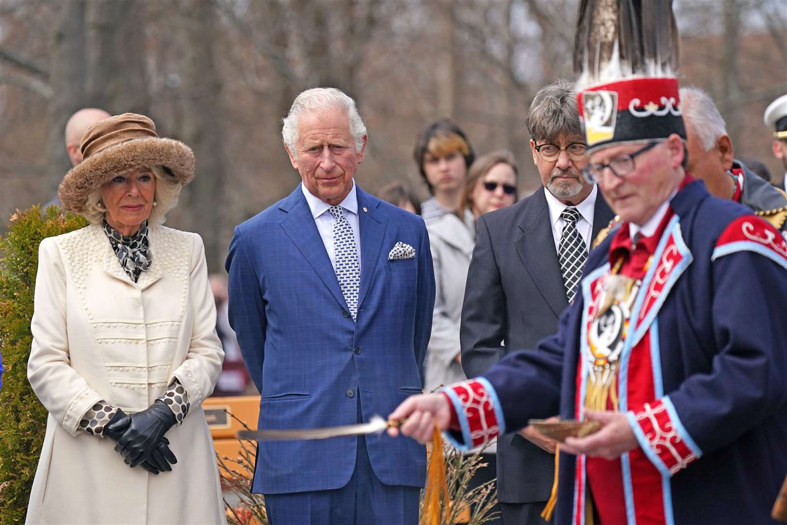 The Prince of Wales (second left) and Duchess of Cornwall attend a solemn ceremony in a Heart Garden remembering indigenous victims of Canada’s residential school system (Jacob King/PA)