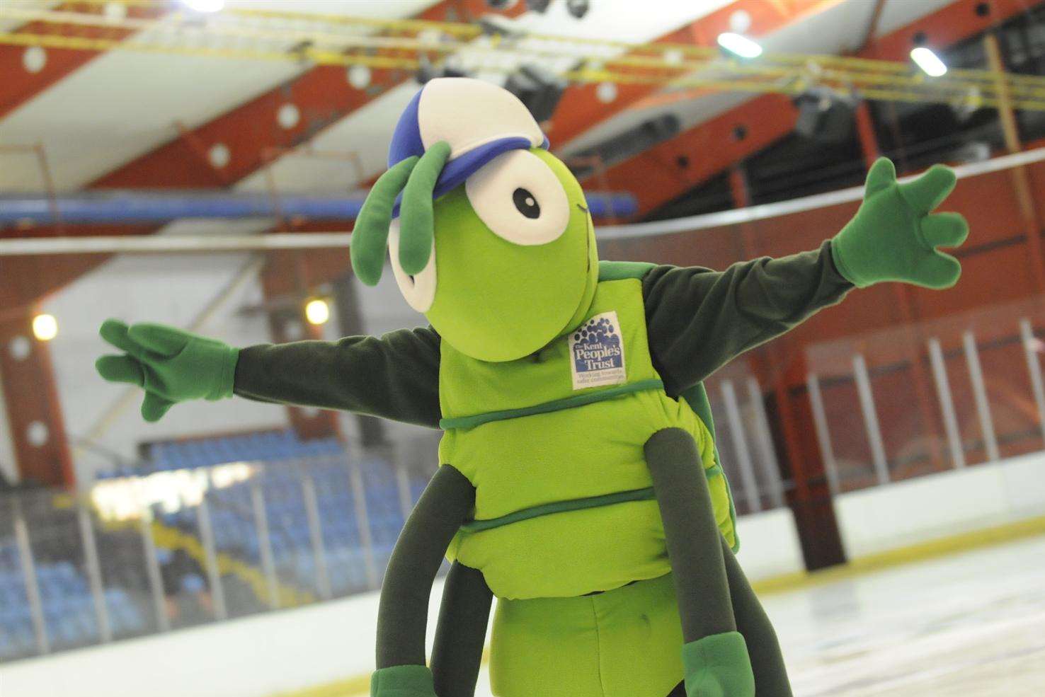 KM Walk to School mascot Buster Bug takes a turn on the ice at Silver Blades Ice Rink.