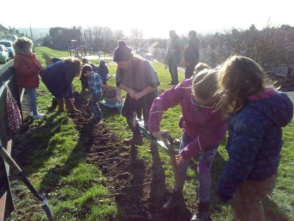 Residents lent a hand to plant the bushes. Picture: Jenny Holliday