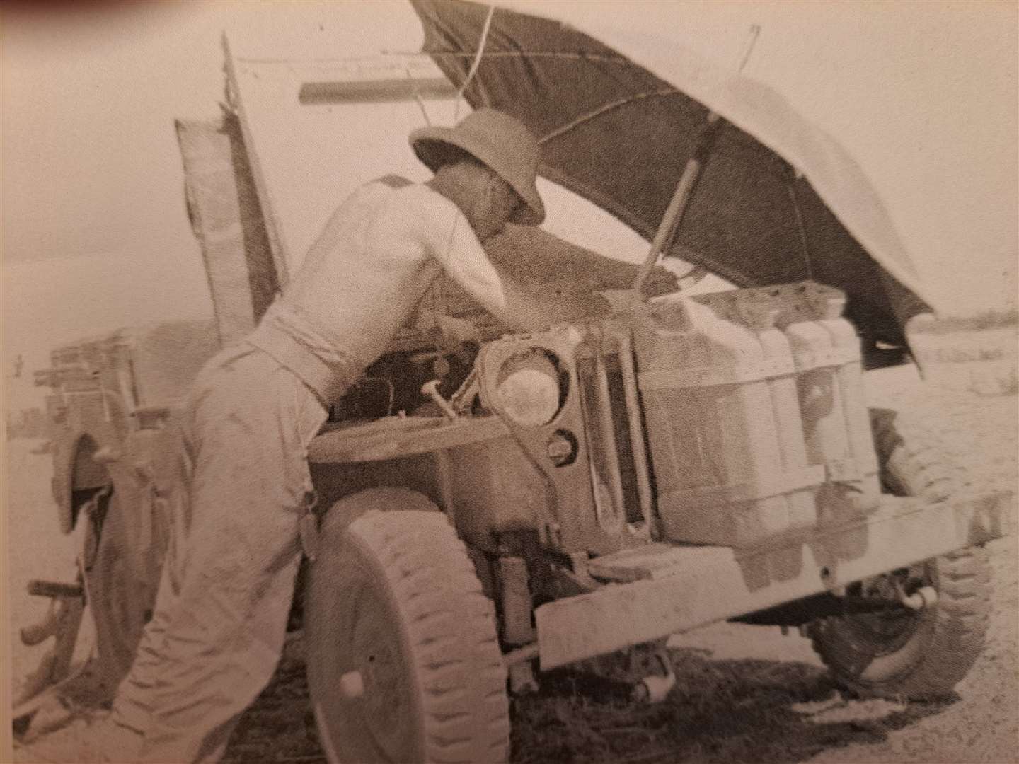 Bill Horn at work on a Willys-Overland Jeep in Persia during the Second World War