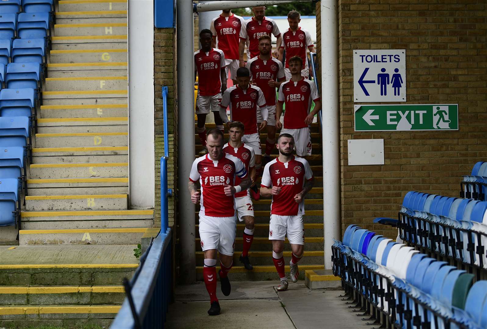 The Fleetwood players emerge from their temporary dressing room at the Rainham End. Picture: Barry Goodwin (42842991)