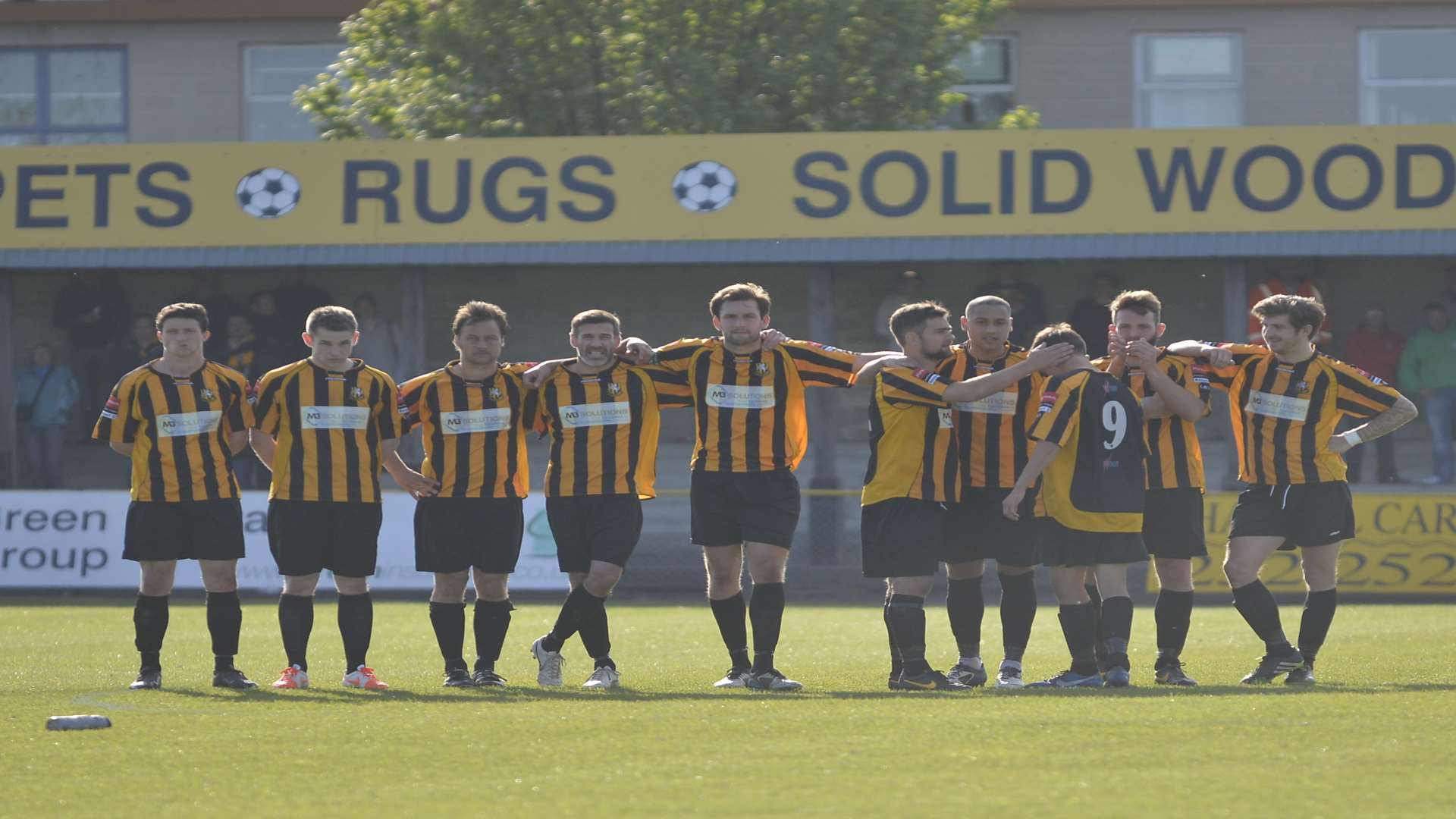 Folkestone's players stand together during last season's penalty shootout defeat Picture: Gary Browne