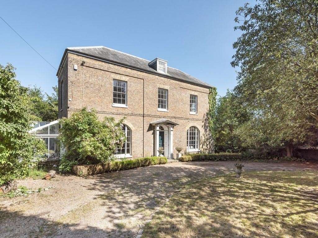 This grade II manor house sits on a one acre plot, it has five bedrooms spread across three storeys. Photo: Zoopla