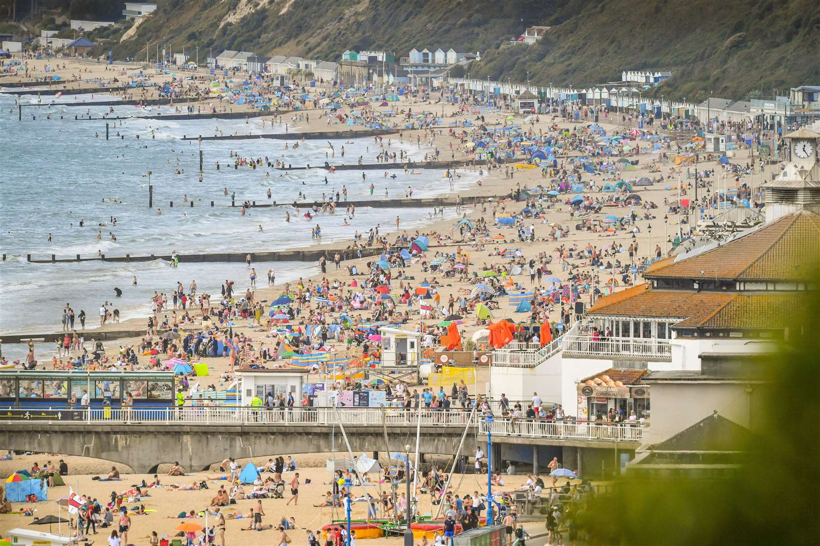 People enjoy the hot weather on the beach at Bournemouth (Ben Birchall/PA)