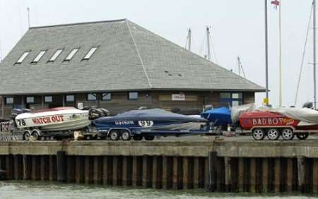 Power boats sitting on the harbour walls, prevented from racing by rough seas. Picture: Matt McArdle
