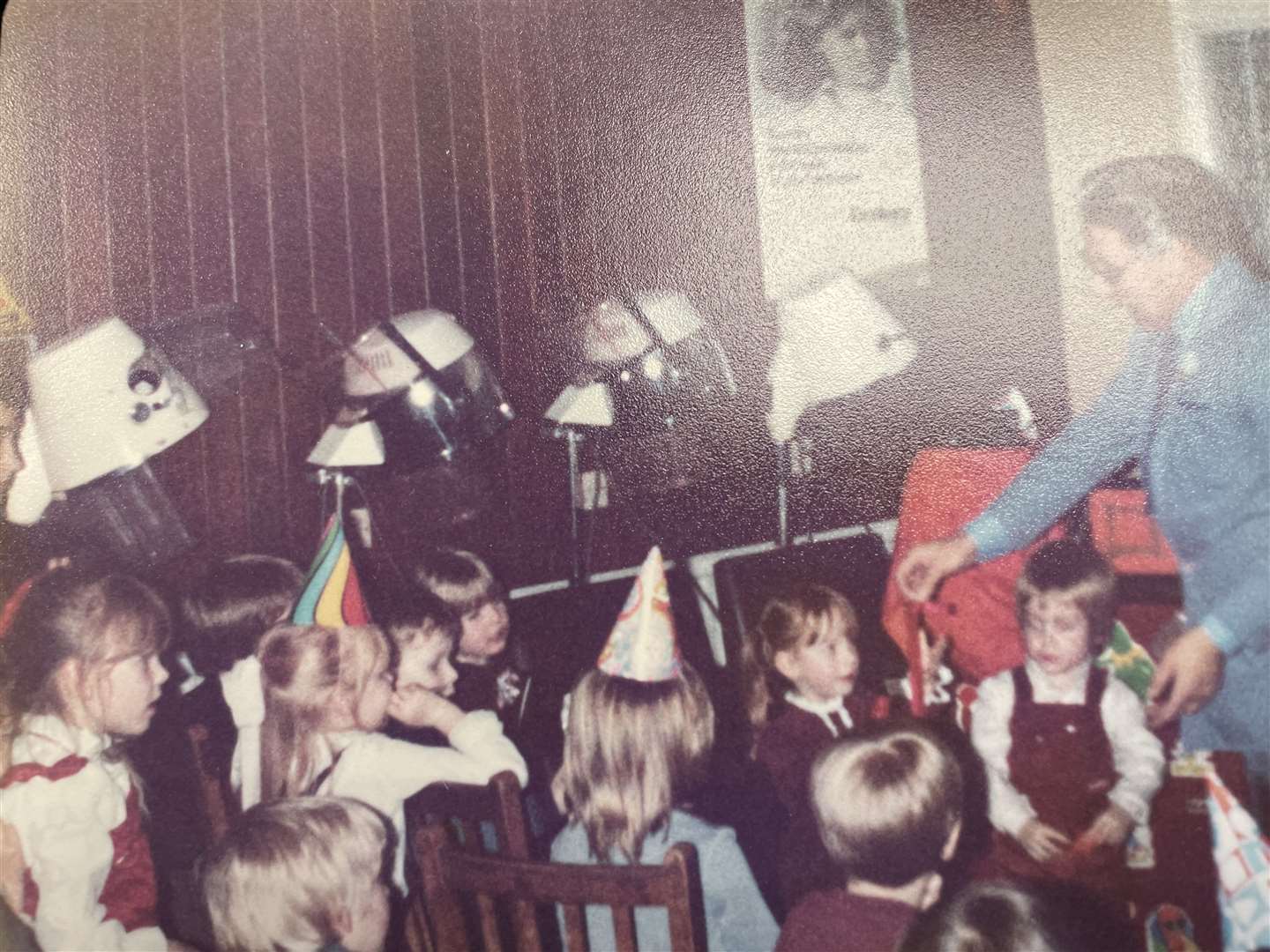 This picture of Irene's son's birthday party, which she hosted at the salon, shows the hood dryers that used to line one of the walls