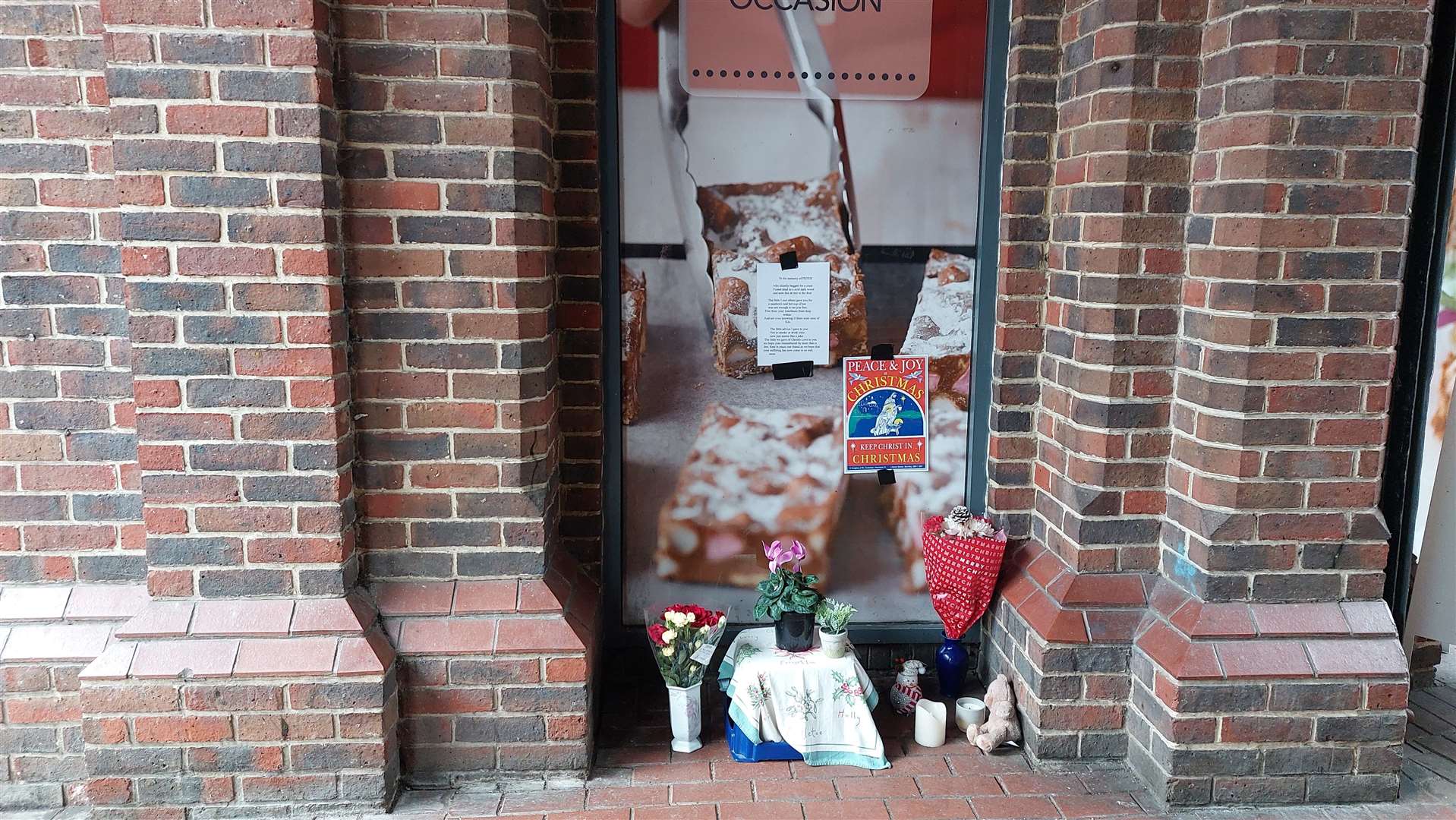 The tributes to Piotr outside Greggs in Park Mall, Ashford