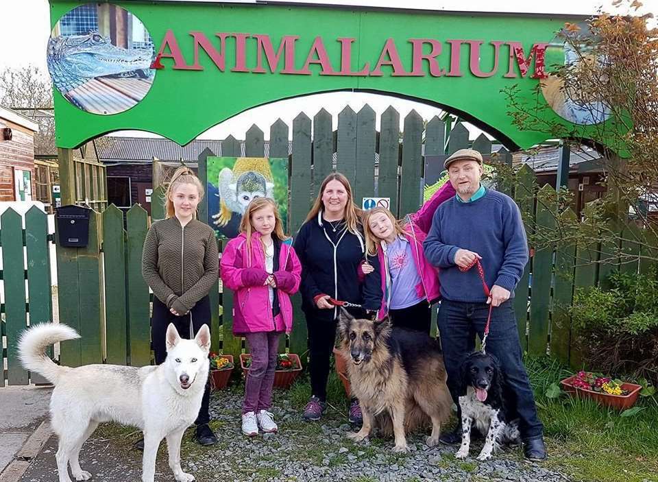 Dean, far right, and family outside their new home