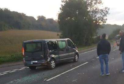 Witnesses examine the damage caused after the crash which killed motorcyclist