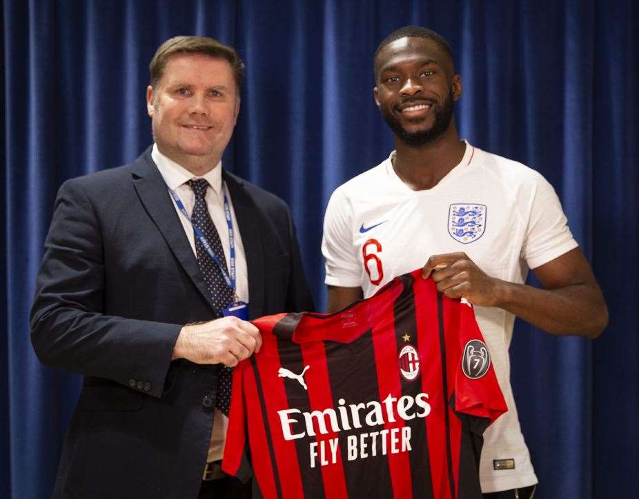 Gravesend Grammar School headteacher Mr Moaby with former pupil and AC Milan defender Fikayo Tomori. Picture: Gravesend Grammar School