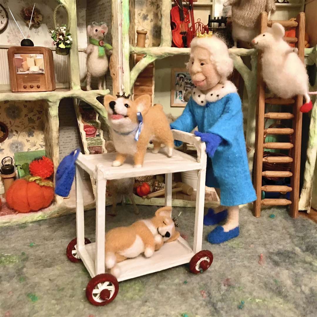 The Queen with her corgis and her friends the mice