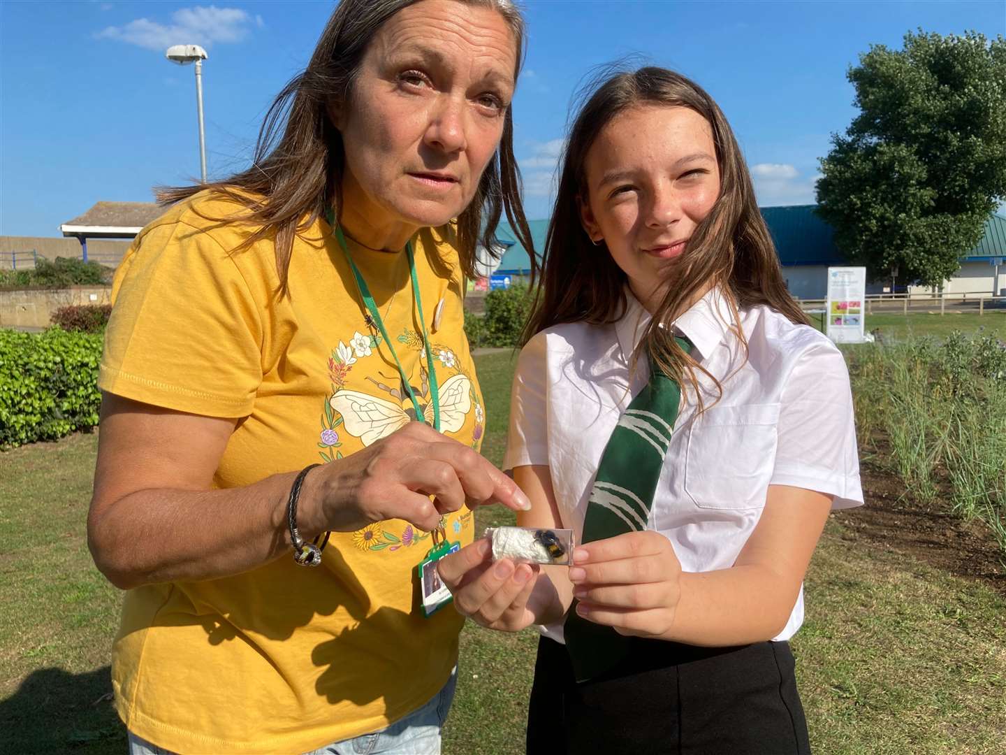 Emma Lansdell from the Bumblebee Conservation Trust checks out a queen buff bumblebee found in Beachfields, Sheerness, by Oasis Academy pupil Summer Smith, 14, during Great Big Green Week