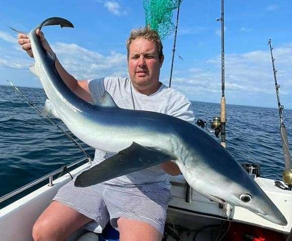 Herne Bay angler Ashley Brown with the impressive blue shark he caught (50935779)