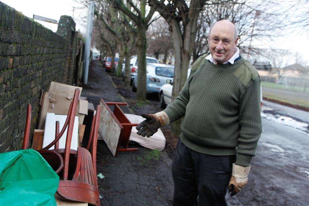 Peter MacDonald with the dumped rubbish in Clarence Row, Sheerness