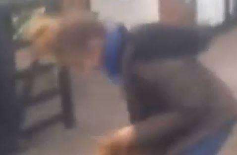 The attacker aims another punch at the schoolgirl