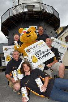 Pudsey Bear (Fred Russon), outside the windmill with, clockwise from front, Luke Smith, Dean Smith, Matt Bromley, Tony Potter and Stuart Hadley