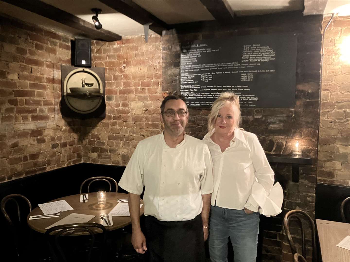 Landlady Tina Beadle with chef Fabio Moro, near the 'haunted corner' of the Scared Crow