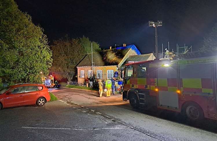 Fire crews and a group of villagers at Rodmersham Primary School following the blaze. Picture: Stock image