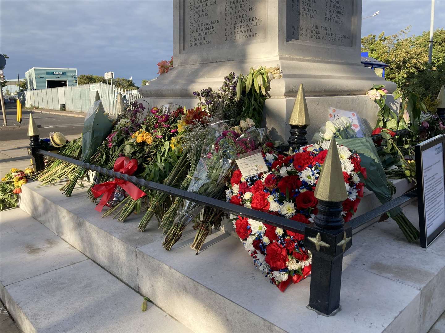 Floral tributes left at the base of the war memorial in Sheerness to mark the death of The Queen. Picture: John Nurden
