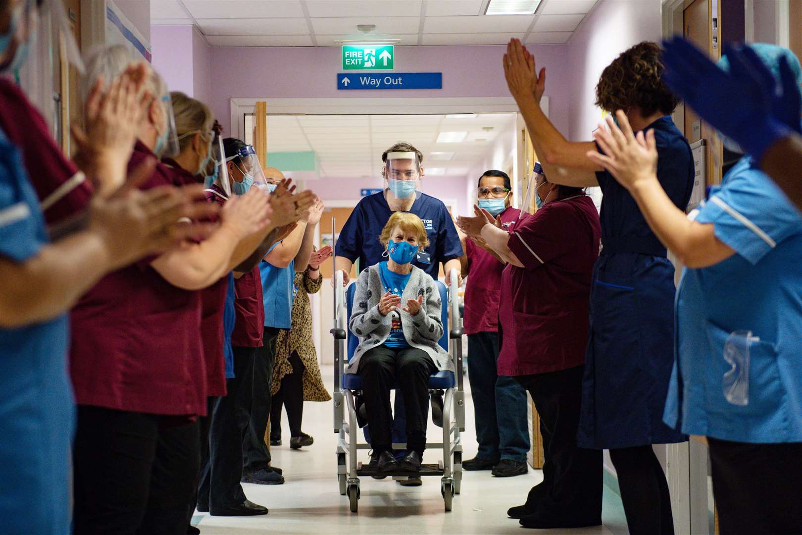Margaret Keenan, 90, was applauded by staff as she returned to her ward after she became the first person in the United Kingdom to receive the Pfizer/BioNTech Covid-19 vaccine at University Hospital, Coventry, at the start of the largest ever immunisation programme in the UK’s history (Jacob King/PA)