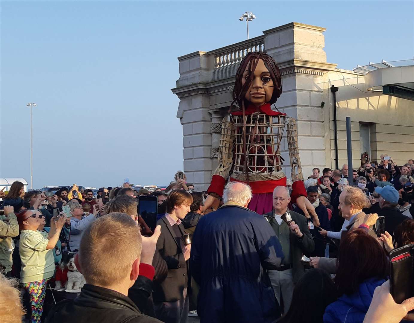 Amal is greeted by the crowd at the old Folkestone Harbour Station