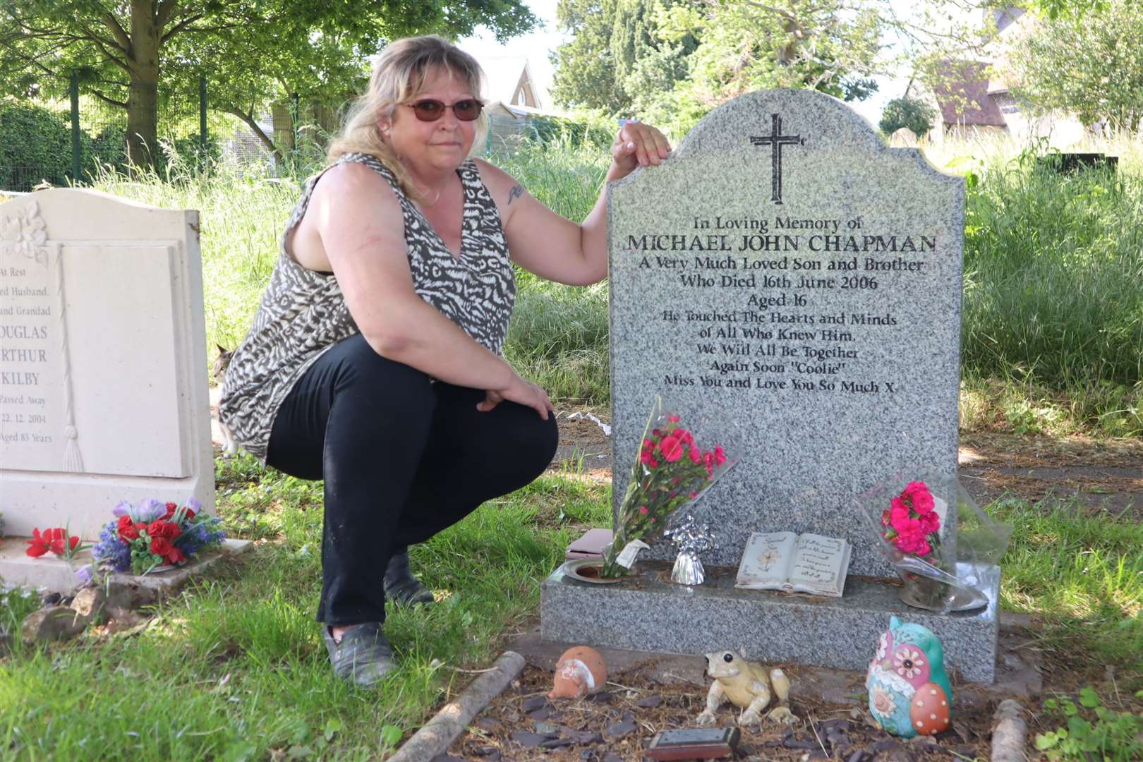 Sue Chapman in Bobbing churchyard at her son Michael's grave. Picture: John Nurden