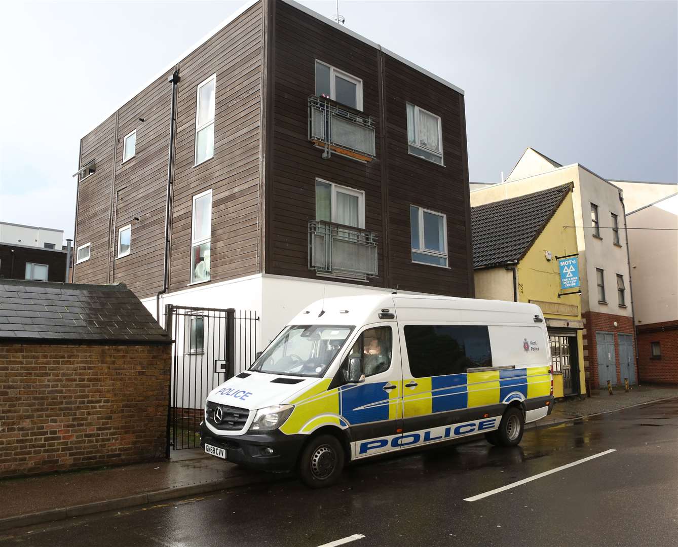 Police outside a block of flats in Fox Street, Gillingham. Picture: UKnip. (24844631)