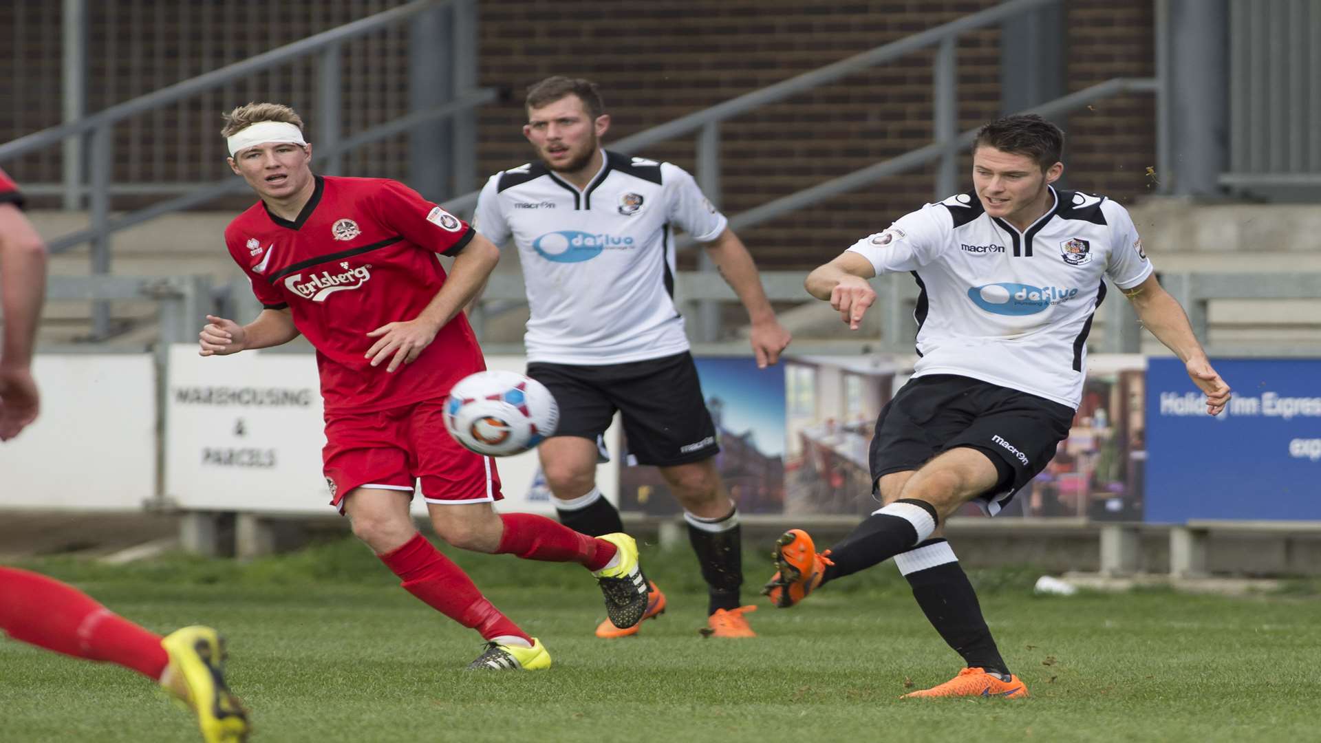Dartford defender Tom Gardiner clears his lines Picture: Andy Payton
