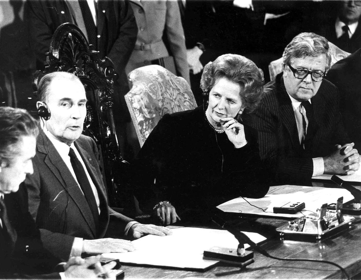 Prime Minister Margaret Thatcher and President Francois Mitterand sign the Channel Tunnel treaty at a special ceremony at Canterbury Cathedral after arriving amid hundreds of protestors