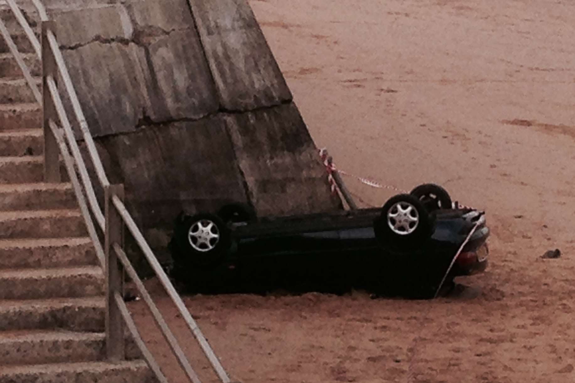 A car crashed through railings on to the beach in Ramsgate.