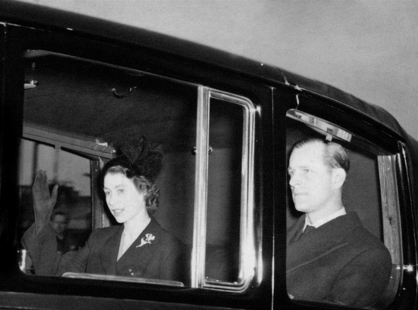 The new Queen, Elizabeth II, returns to Clarence House with the Duke of Edinburgh after the sudden death of her father (PA)