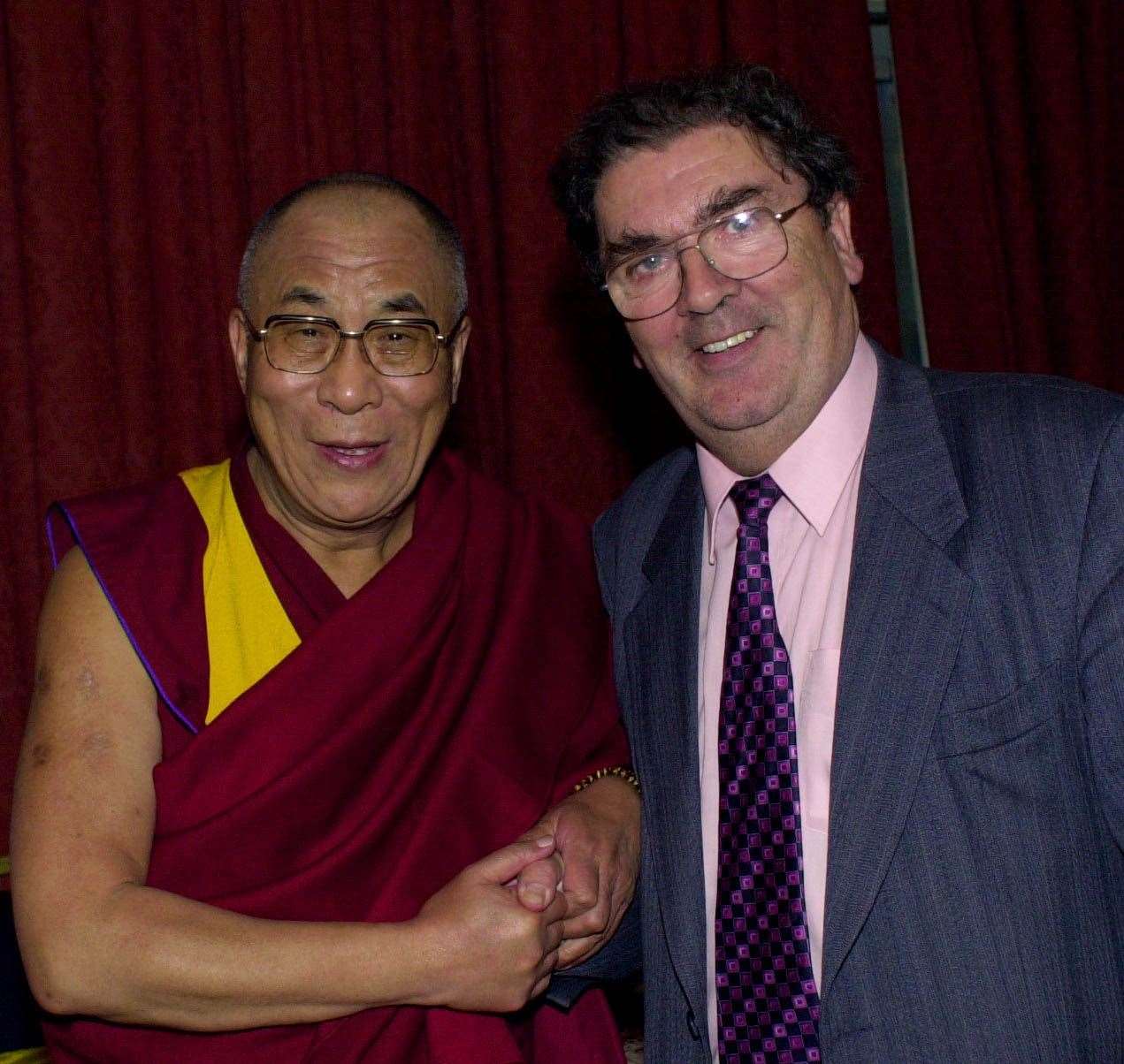 The Dalai Lama meets fellow Nobel Peace Laureate John Hume (Martin McCullough/PA)