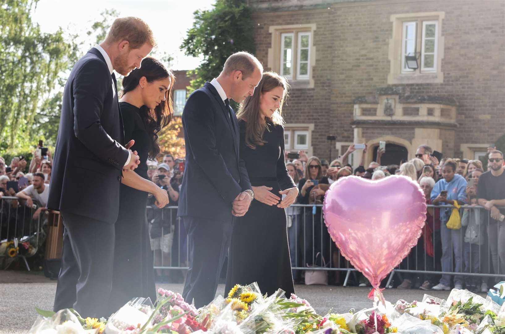 The Prince and Princess of Wales and the Duke and Duchess of Sussex viewing the messages and floral tributes (Chris Jackson/PA)