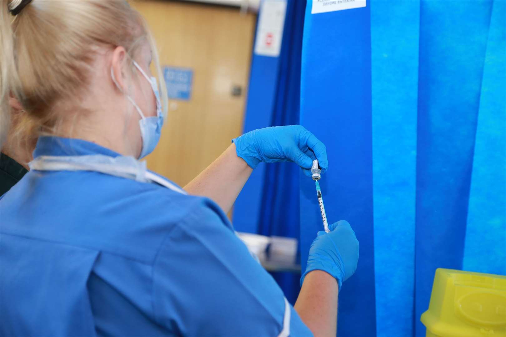 A nurse gives out the Covid-19 Pfizer vaccine at Medway Maritime Hospital in Gillingham this week. Picture: Medway NHS Foundation Trust