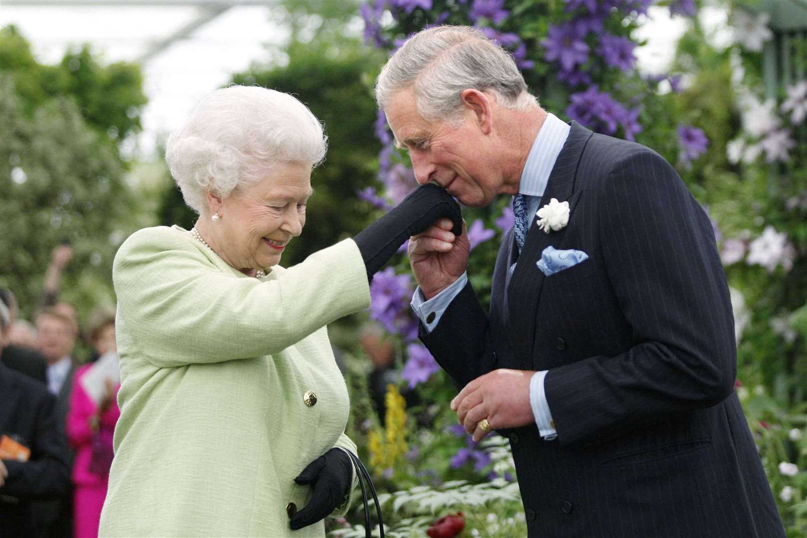 The late Queen presenting her son the then-Prince of Wales with the Royal Horticultural Society’s most prestigious award, the Victoria Medal of Honour at Chelsea in 2008 (Sang Tan/PA)