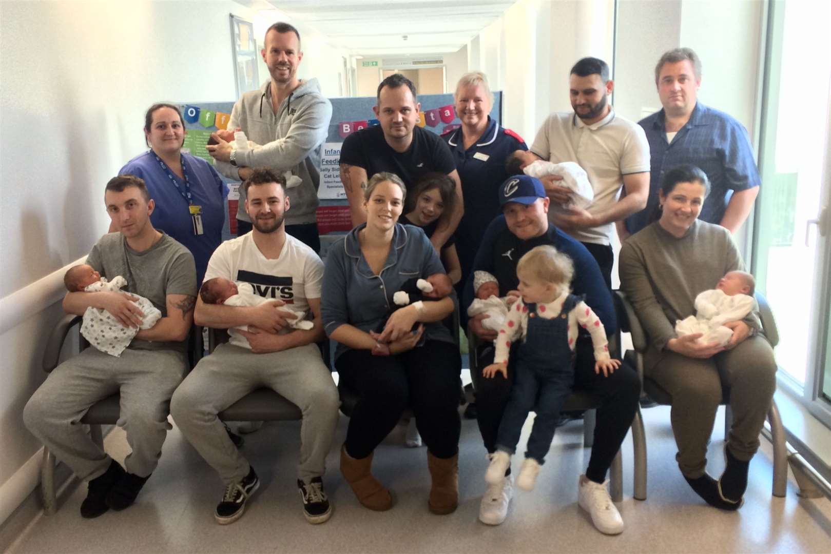 Back row: from left, maternity support worker Jo Stone; Chris Grover with Sadie Lilly; John Logan with his elder daughter Grace, transitional care manager Jane Jeal; Nikolay Yordanov and Nikol; dad Richard Draper. Front row from left: Ben Pettit with Ronnie; Ryan Gorman with Frankie; Danielle Cumberworth with Fraser; Billy Harty with baby Billie and stepdaughter Rosie, and Lauren Draper with Rosella