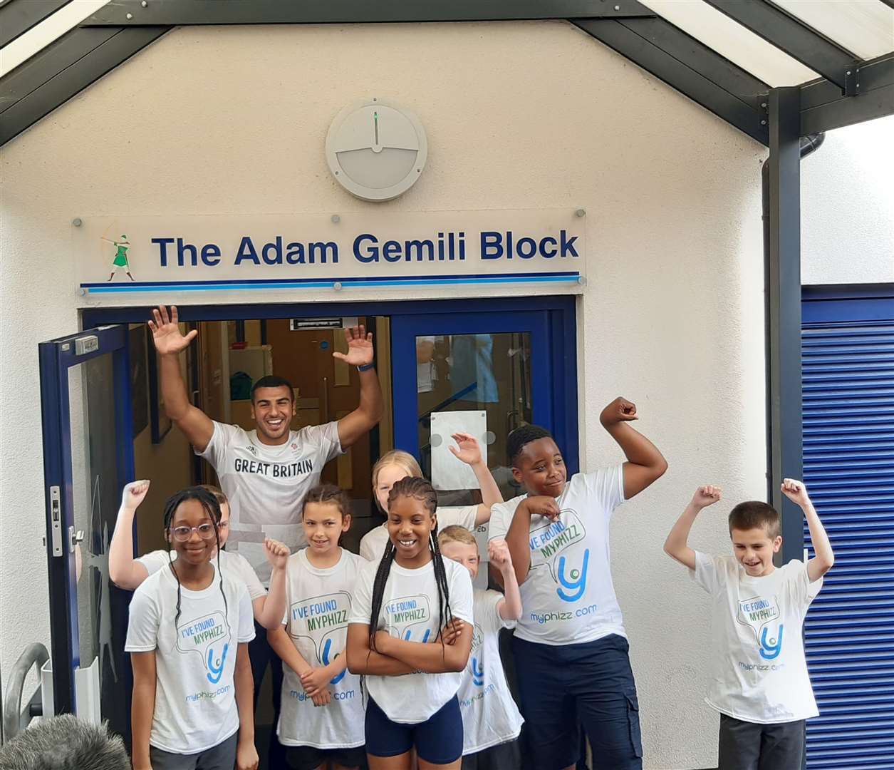 Adam and year five pupils outside the block named after the Olympic sprinter. Photo: Sean Delaney
