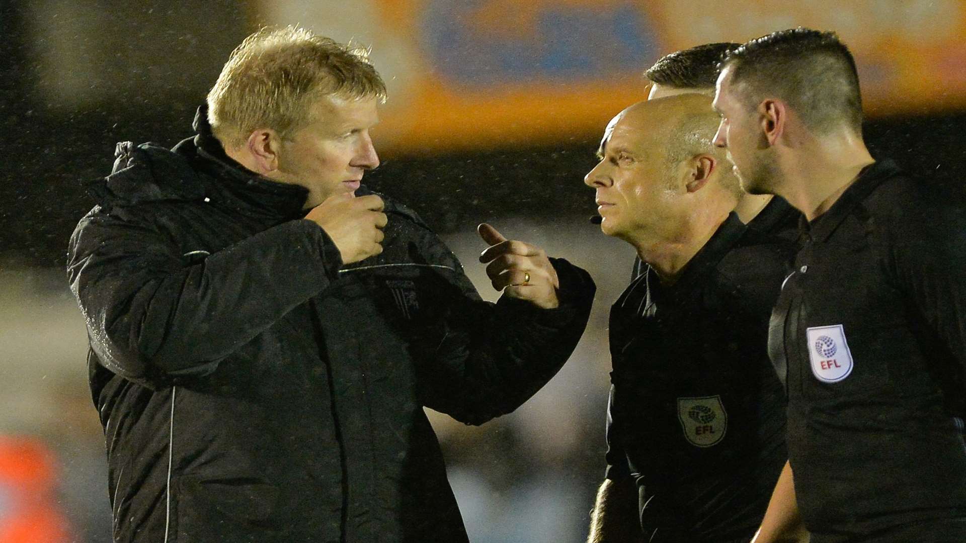 Ady Pennock discusses Lee Martin's red card with referee Nick Kinseley