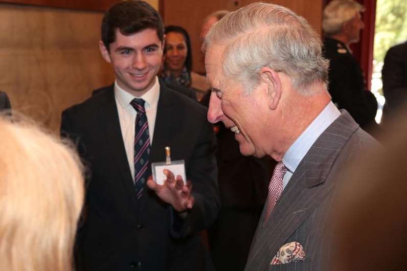 Prince Charles laughs after posing for a selfie with teenager Joseph Wilson, pictured left. Picture: Martin Apps