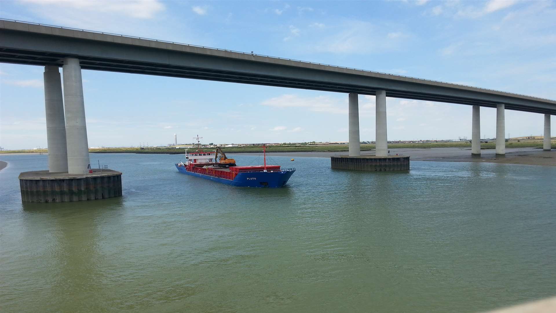 The Pluto sails under the Sheppey Crossing