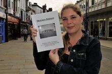 Karyn Wood, with a copy of the book she has written about the defences of Sheerness